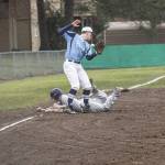 Staff photo/Greg Sellentin                                Nick Herko slides into third base safely.