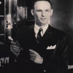 Contributed by Rae Kozloff. Kozloff posing with his research.