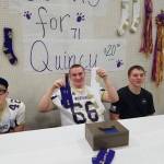 Contributed photo/Stacey Smith                                Christine Minney&rsquo;s son personalized socks to raise money at the fundraiser &mdash; one with Quincy&rsquo;s name and the other with his football jersey number.