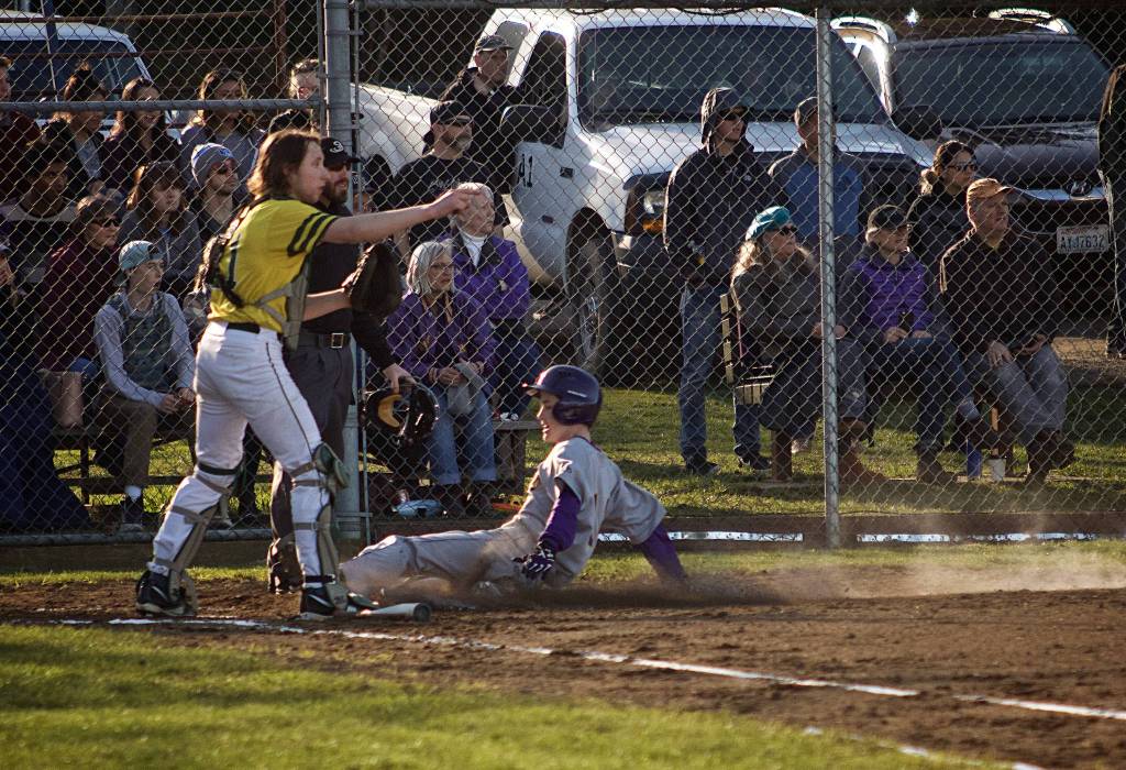 Photo/Greg Sellentin - Eli Cooper-West slides into home base to score in the fourth inning