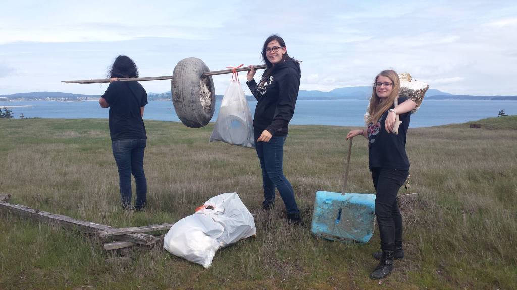 Contributed photos/Great Islands Clean-Up                                Islanders collect trash during a past Great Islands Clean-up.
