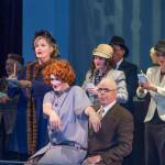 Billy Flinn (Bo Turnage) takes over Roxie Hart&rsquo;s (Amanda Smith) voice to tell her case to the press