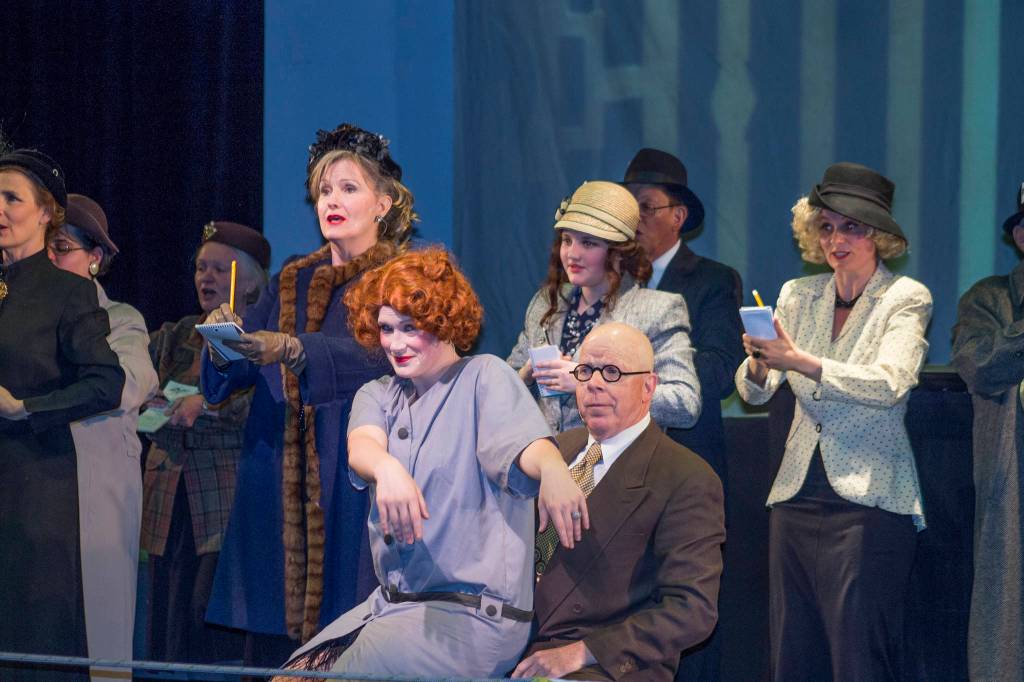 Billy Flinn (Bo Turnage) takes over Roxie Hart&rsquo;s (Amanda Smith) voice to tell her case to the press