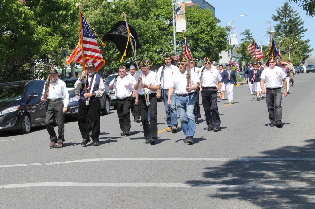 Staff photo/Hayley Day                                The American Legion Post 163 starts the parade on Second Street.