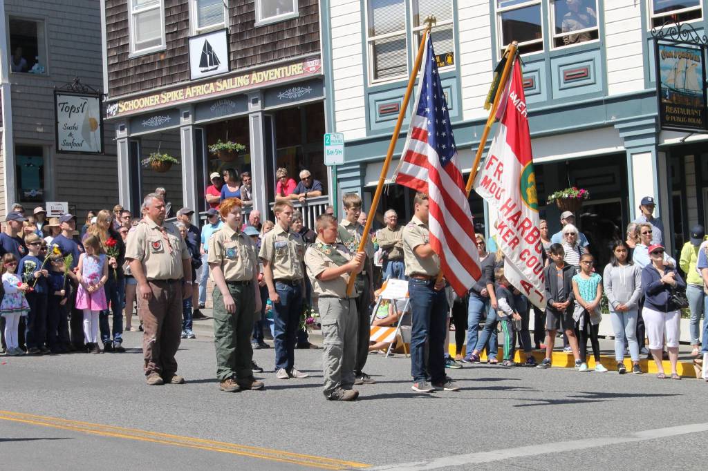 Staff photo/Hayley Day                                Local boy scouts march down Spring Street during the Memorial Day parade.