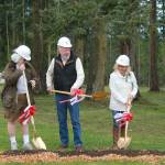 Staff photo/Heather Spaulding                                The McDowells and Rebecca Pohlad break ground with golden shovels.