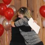 Staff photo. Marine Tech graduate hugs EDC director Victoria Compton.