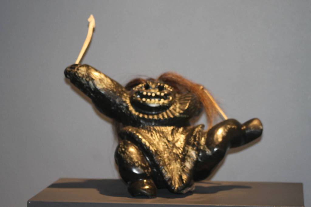 Staff photo, Heather Spaulding. &ldquo;Woman Bow Hunting&rdquo; by Inuit artist Uriash Pukingnak.