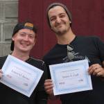 Staff photo. marine Tech graduates Robert Barns and James Gull show off their certificates.