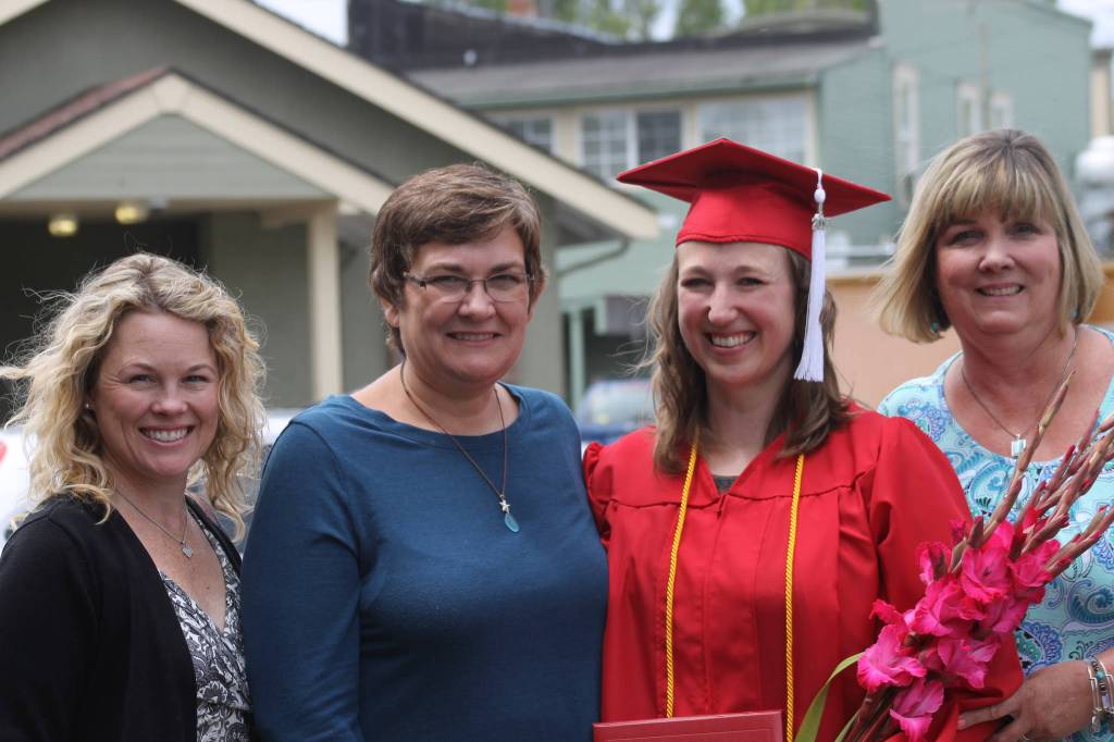 Staff photo/ Heather Spaulding                                Graduate Autumn Hallock with her supporting friends.