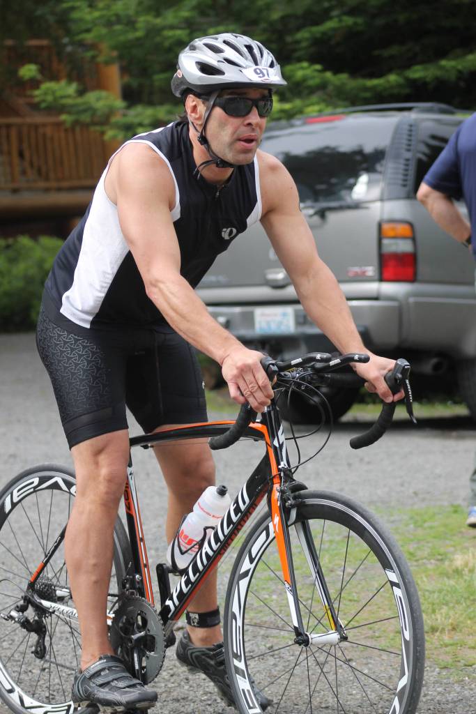Staff photo. Biker heads to the finish line, only to prep for the run.