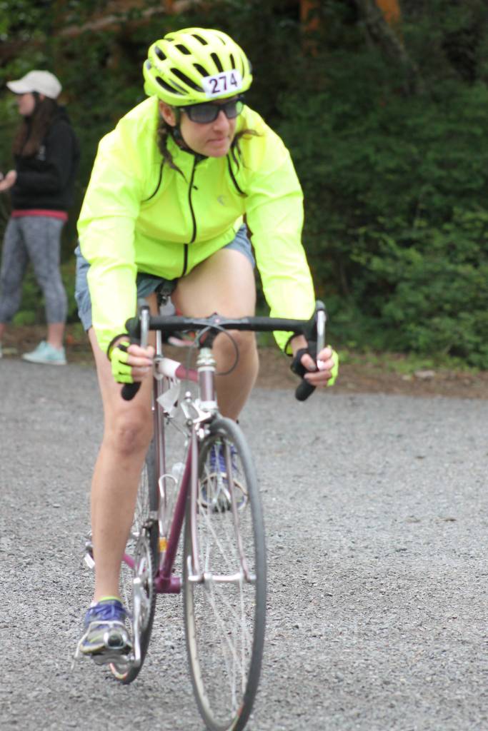 Staff photo. Biker approaches finish line, only to begin the running component.