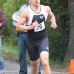 Staff photo. Runner begins the last leg of the race