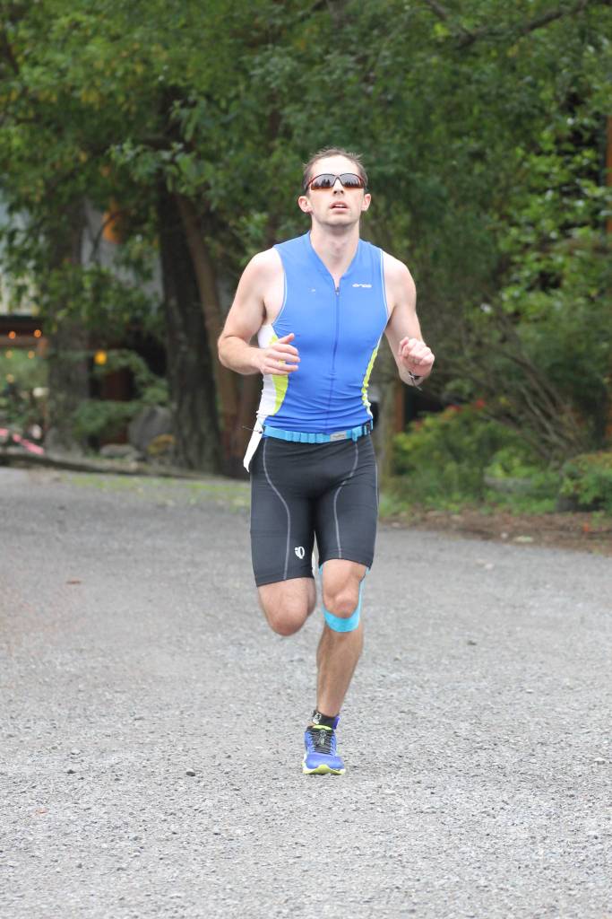 Staff photo. Runner heads toward the finish line.