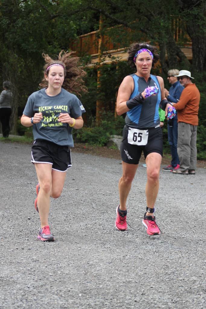 Staff photo. Runners approach the finish line.