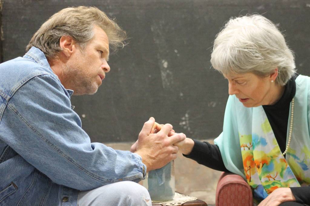 Staff photo/ Heather Spaulding. Brad Fincher and Deb Langhans rehearse as Chris and Alexandra in &ldquo;Velocity of Autumn.&rdquo;