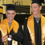 Staff photo/Heather Spaulding                                Graduates Corbin Williams and Eli Cooper West walk toward the podium.