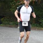 Staff photo, Heather Spaulding. Triathalon Sprint winner Keith Szot approaches the finish line.