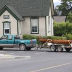 Canoe caravan — islander drives hand-made canoe through town