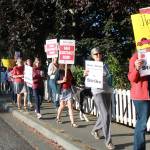 Staff photo/Hayley Day                                San Juan Island School District teachers march up Argyle Avenue to Spring Street on Sept. 1.