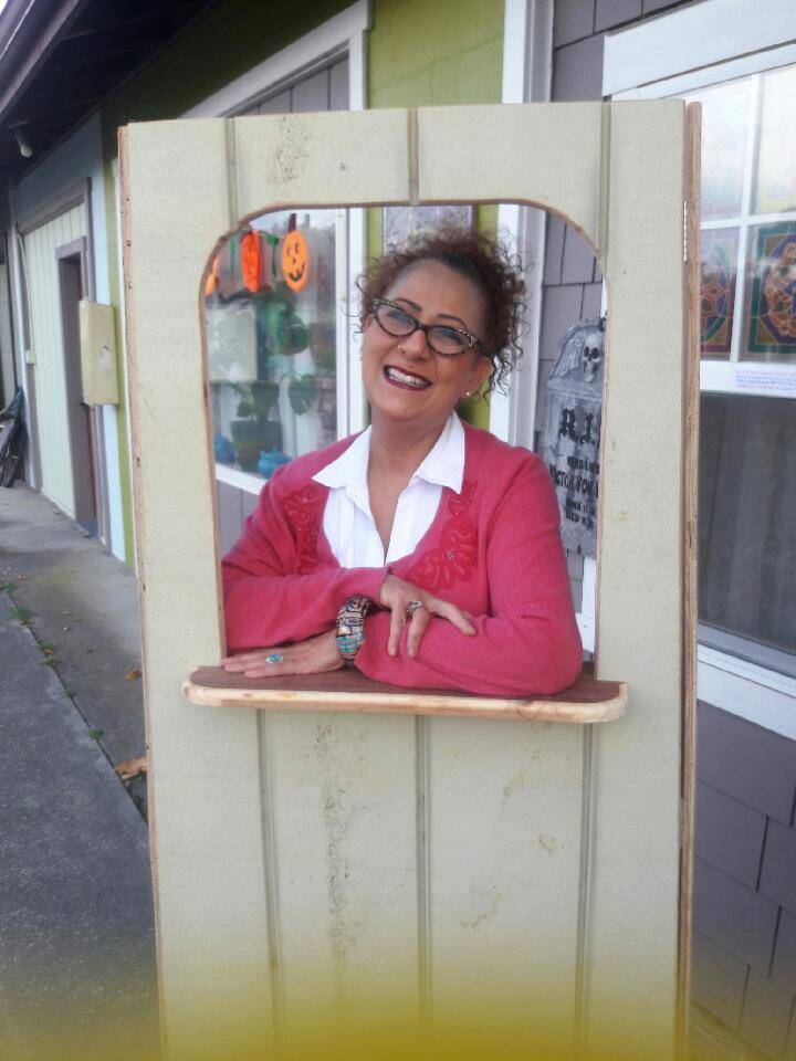 Contributed photo/Evelyn Eaglesong                                Evelyn Eaglesong poses in her new ticket booth outside for the theater.