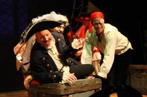 Staff photo/Heather Spaulding                                Staff photo, Heather Spaulding. Black Stache, played by Craig Nett, on his treasure, with a pirate played by Brad Fincher behind him.