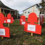 Staff photo/Tate Thomson                                Each red silhouette tells the story of a Washingtonian who passed away from domestic violence in 2016.