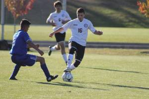 Staff photo/Heather Spaulding                                A Wolverine grabs the ball in a previous game, earlier this season.