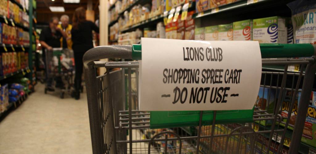 Staff photo/Hayley Day                                Kings employees position extra carts around the store for the winner to restock as carts fill.