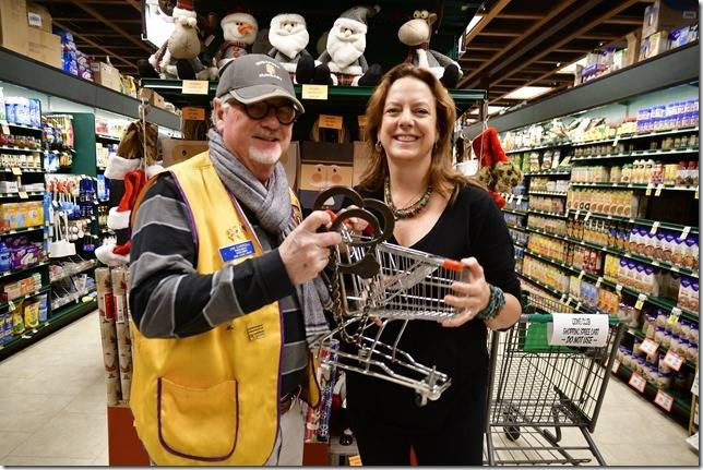 Contributed photo/Bill Waxman                                Jim Carroll and the winner with Jon Zerbys old shackles and a miniature shopping cart.