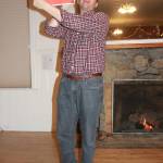 Staff photo/Heather Spaulding                                Brendan Cowan holds a sign DEM has on hand to signify if you need help after a disaster.