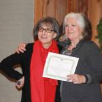 Staff Photo Heather Spaulding. Becki Day presents the award for best Utilities to San Juan Wireless