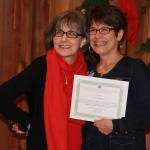 Staff photo Heather Spaulding. Tracy James accepts the Professional Services for Eagle Home Mortgage