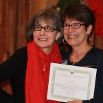 Staff photo Heather Spaulding. Tracy James accepts the Professional Services for Eagle Home Mortgage