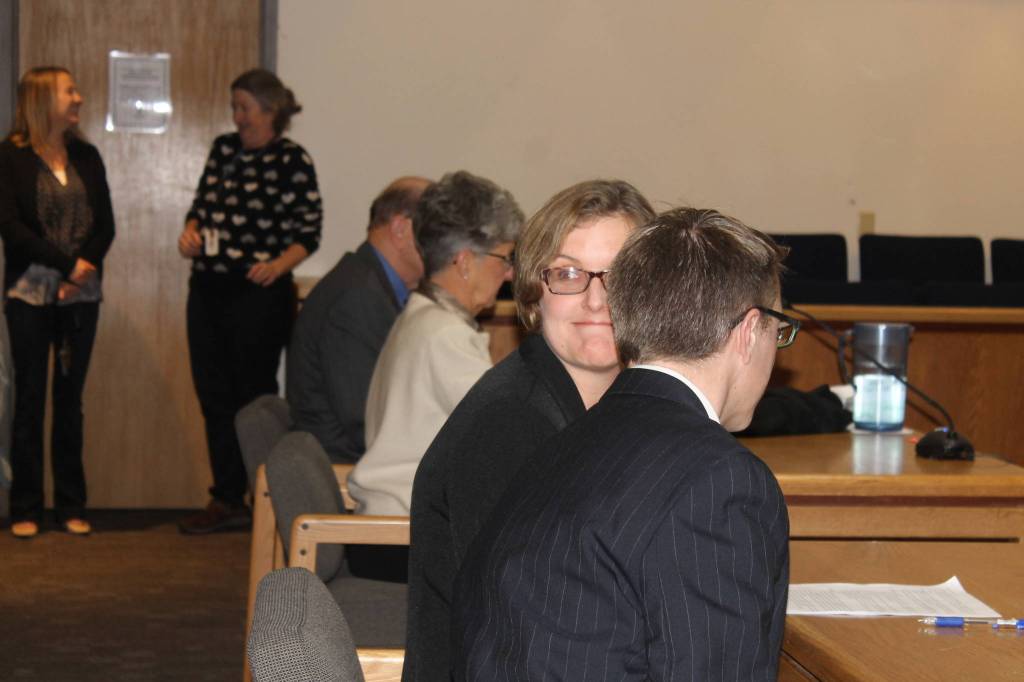 Staff photo/Heather Spaulding Katie Loring awaits to be sworn as she sits next to her husband Kyle Loring.