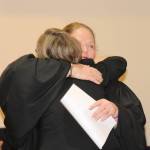 Staff photo/Heather Spaulding Washington State Supreme Court Judge Mary Fairhurst and Katie Loring hug after Loring is sworn in.