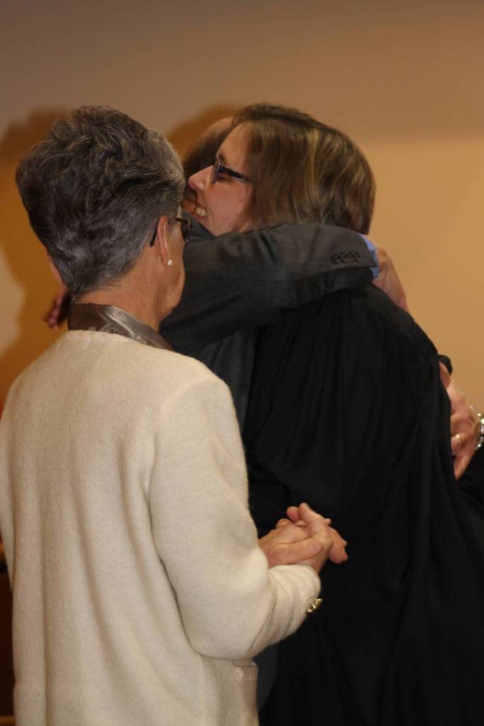Staff photo/Heather Spaulding San Juan Superior Court Judge Katie Loring hugs her father.