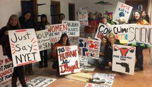 Contributed photo                                Protesters from last years march display their signs.