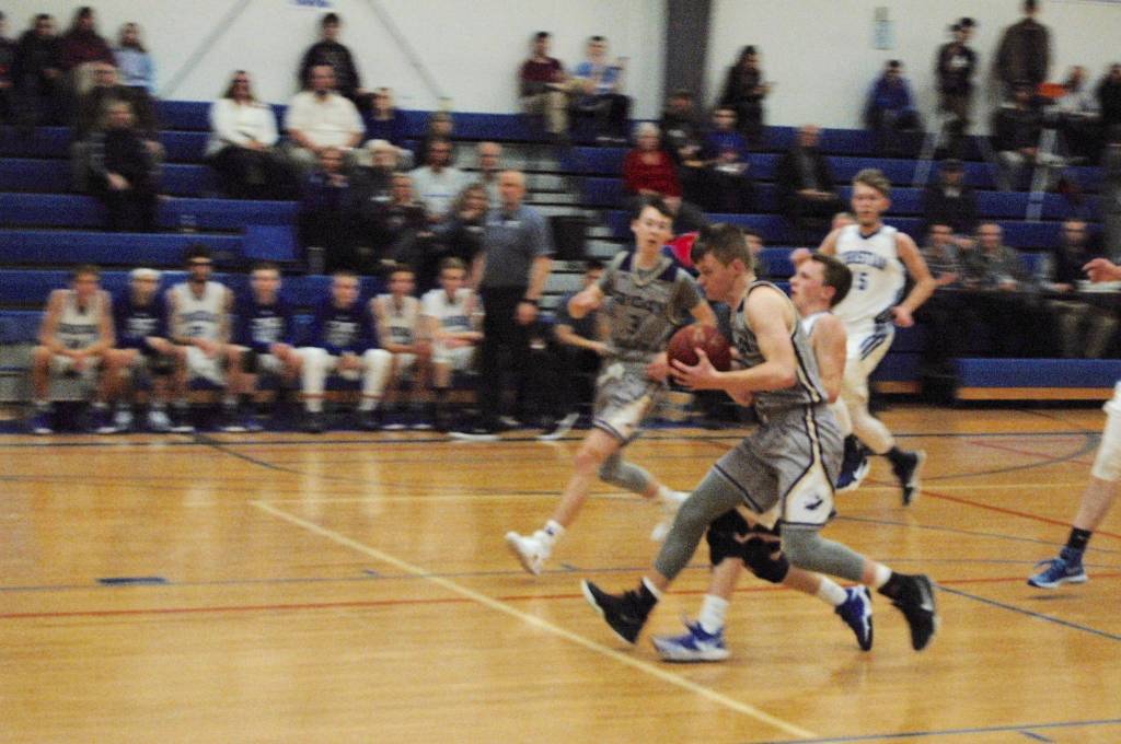 Contributed photo/John Stimpson                                Wolverine Chase Wilson leads the fast break on the teams surge in scoring.