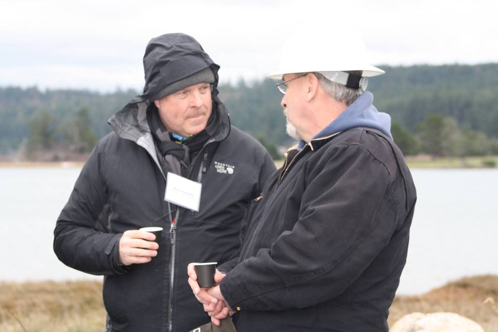 Staff photo/Hayley Day                                County Councilman Rick Hughes (left) enjoys sake at the event.