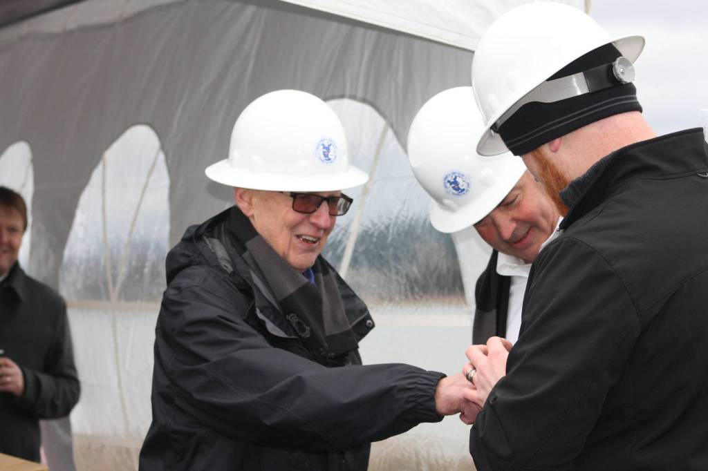 Staff photo/Hayley Day                                Retiring OPALCO Board Member Jim Lett energizes the cable at the event, which was on his birthday.
