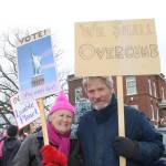 Staff photo/Heather Spaulding Islanders Helen Machine-Smith and Daniel Mayes hold their signs at the protest.