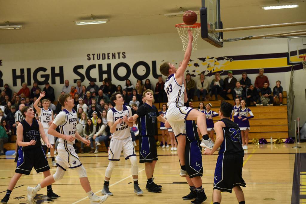 Contributed photo/John Stimpson                                Rio Black fights his way to a 2-point layup.