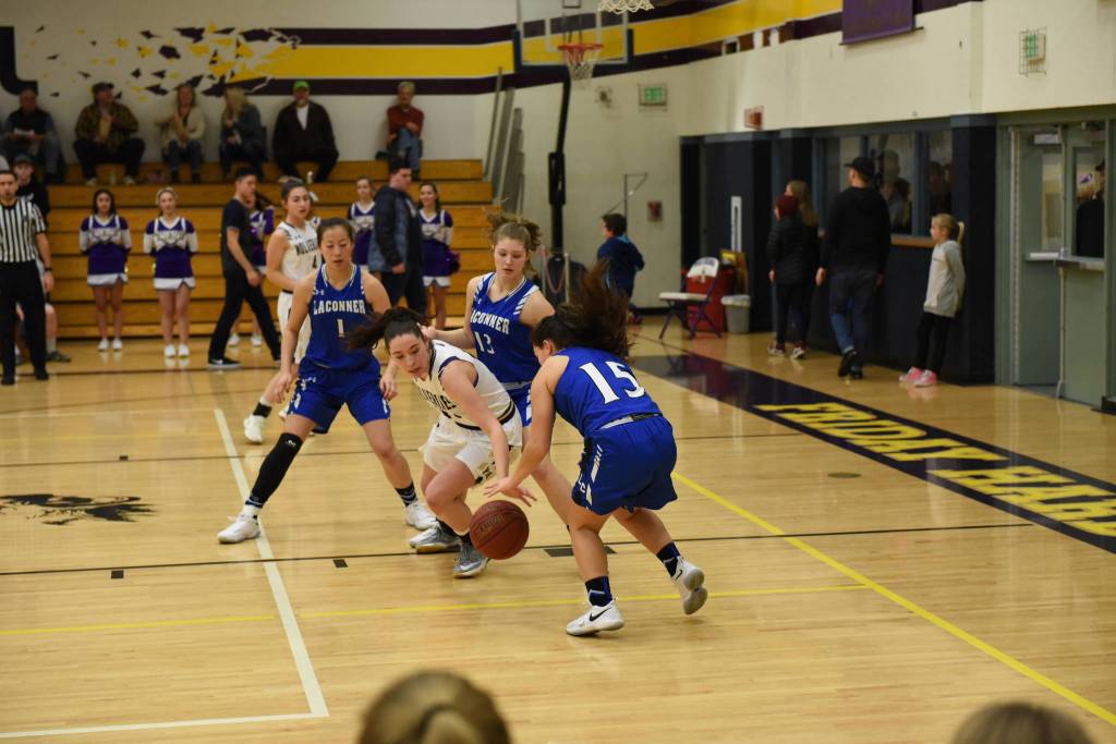 Contributed photo/John Stimpson                                Kiana Woods fights for a loose ball.