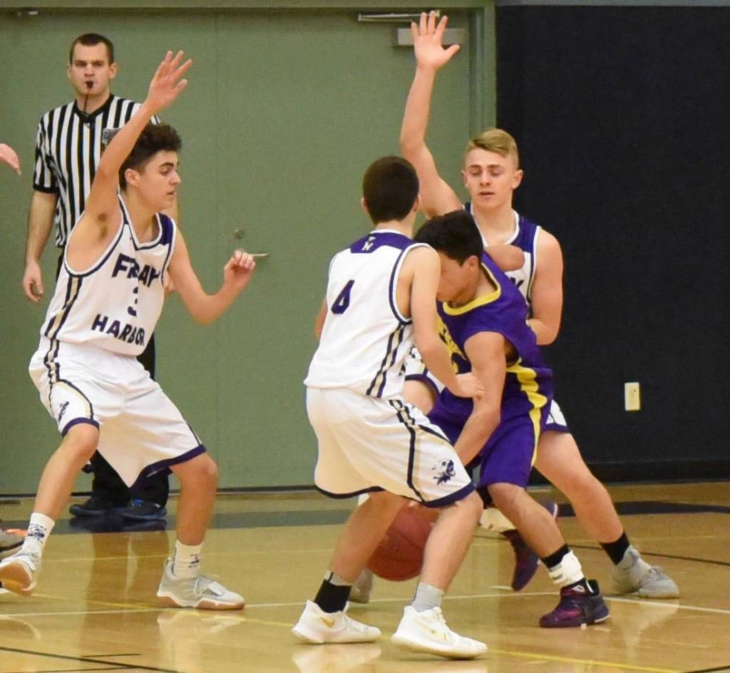 Contributed photo/John Stimpson                                Applying pressure was Miles Williamson, Ty Anderson and Jaden Jones.