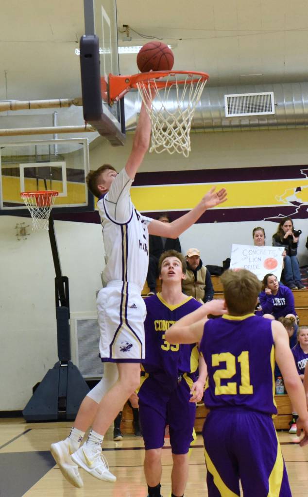 Contributed photo/John Stimpson                                Marshall Clark reaches high to drop the ball in against Concrete.
