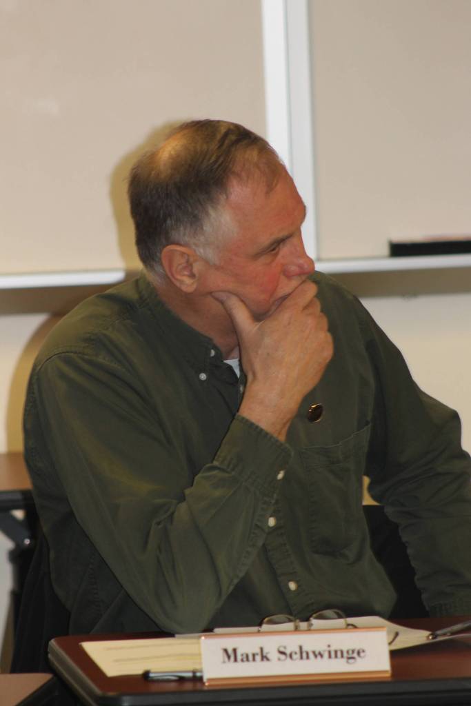 Staff photo/Heather Spaulding Commissioner Mark Schwinge listens to applicants.