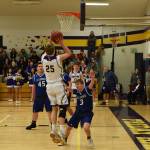 Contributed photo/John Stimpson                                Isaac Mayer fights his way to the basket to continue the scoring run.