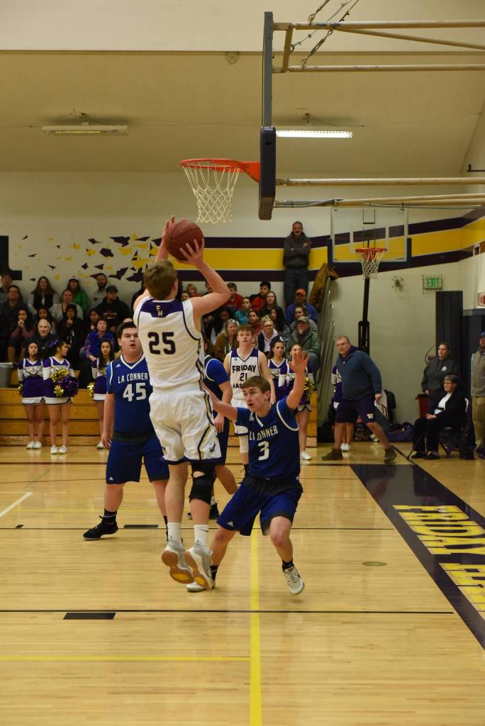Contributed photo/John Stimpson                                Isaac Mayer fights his way to the basket to continue the scoring run.