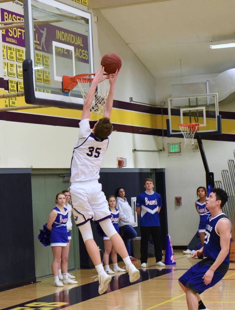 Contributed photo/John Stimpson                                Marshall Clark slam dunks to the cheers of the crowd.